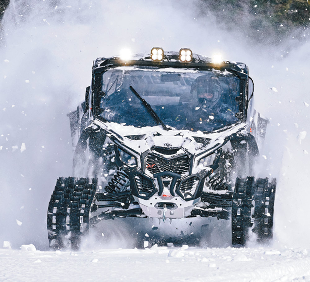 ATV driving through the snow