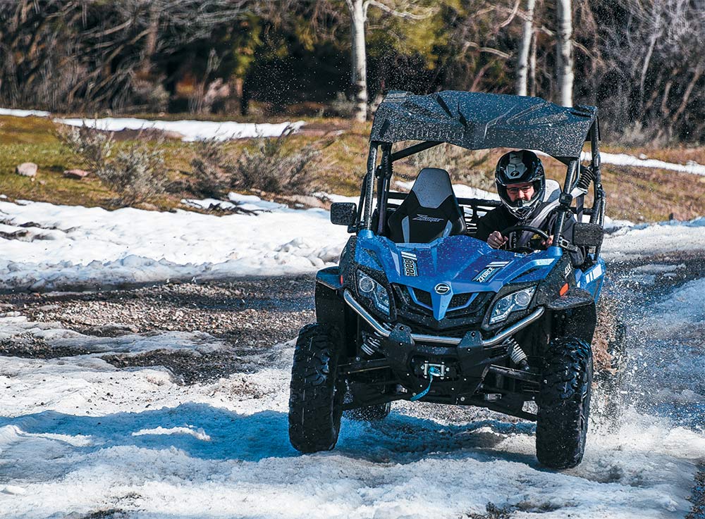 CFMoto ZForce 1000 being driven in the snow